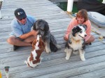 Leo with his doggie friends, Lucy and Eli at the sunset conch horn blowing festivities