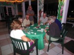 Randy learing to play dominos with new friends at the Marsh Harbour Marina