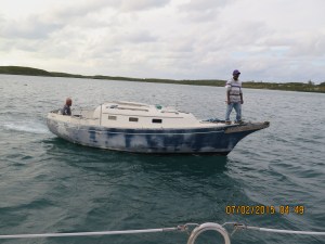 Francis (who we met last time at Hatchet Bay) with his friend, come out to greet us and collect the mooring fee