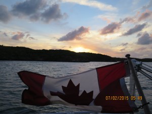 Sunset in Hatchet Bay over Silver Maple's flag