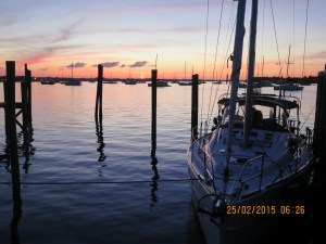 Silver Maple docked at the Conch Inn as sun sets over Marsh Harbour
