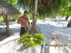 Tour guide serves us fresh fruit on the beach